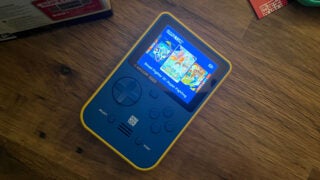 The Capcom blue Super Pocket handheld games console.
