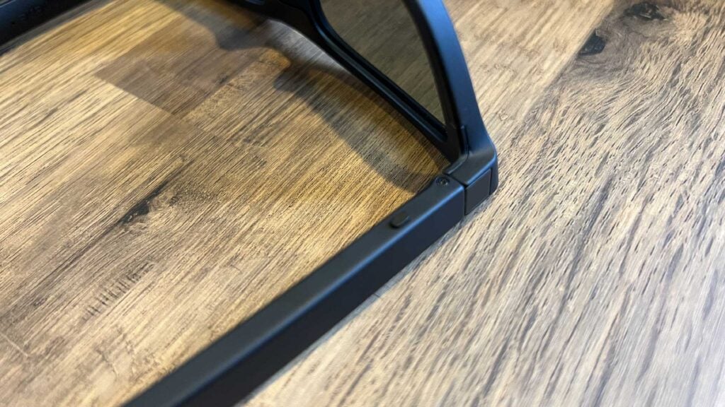 The underside of the Ampere Dusk smart sunglasses showing one of the two buttons.