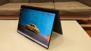 Lenovo Yoga 9i 2-in-1 laptop in tent mode on table.