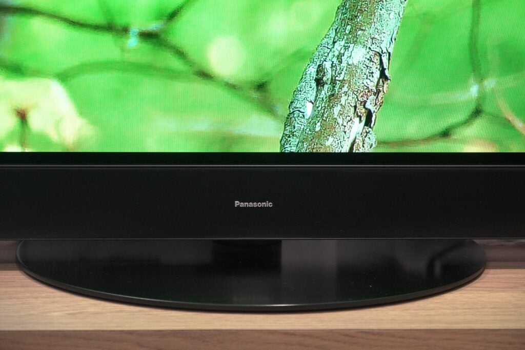 Panasonic Z95A standClose-up of Panasonic TV with nature scene on screen
