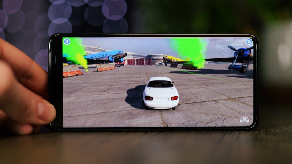 Playing a game on the Vivo X100 ProVivo X100 Pro displaying a racing game screen.