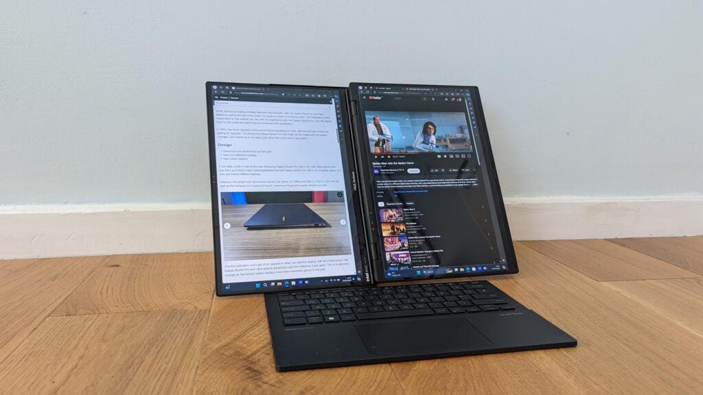 Asus Zenbook Duo laptop with dual screens on wooden floor