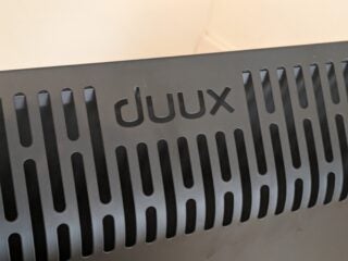 Detail shot of top rear vents, which are stamped with the Duux logo