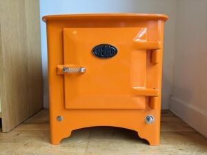 Straight-on photo of the front. Oven in bright orange