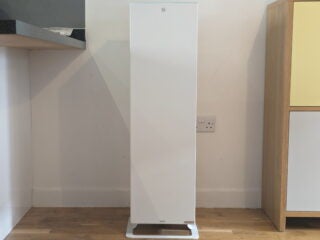 Shot from the front, showing the heater next to a kitchen counter and a cupboard