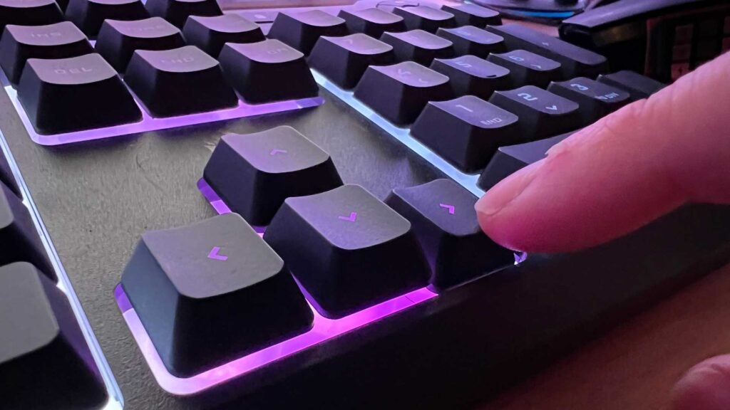 A button being pressed on the Corsair K55 Core keyboard.
