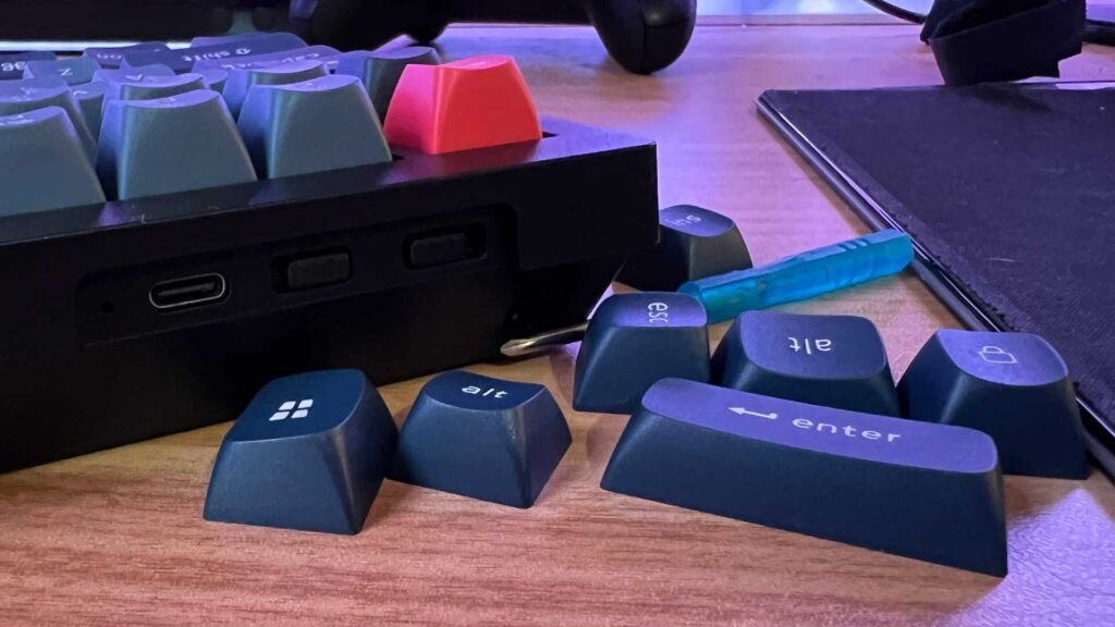 A collection of keycaps that come with the Keychron V1 Max.